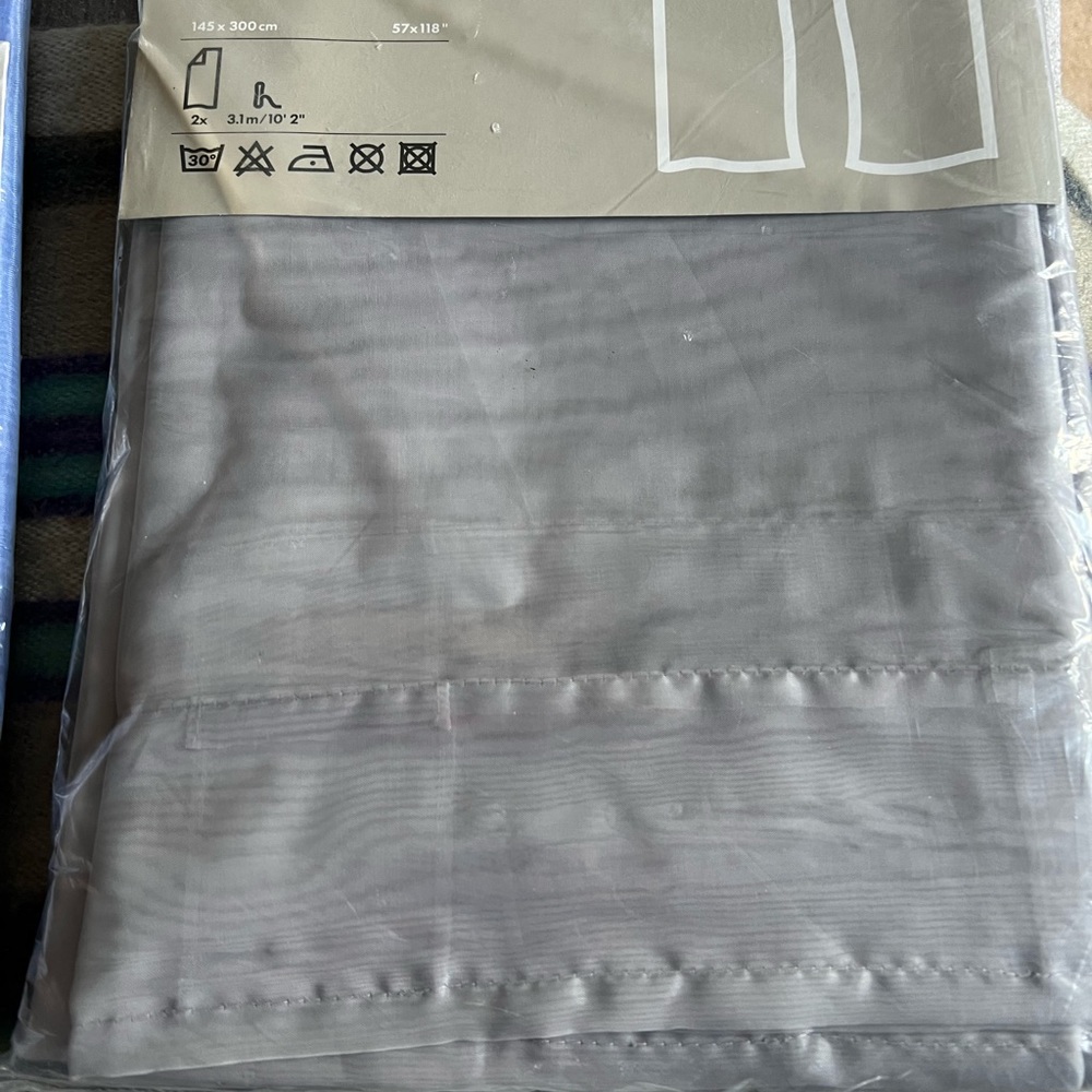 Sheer IKEA curtains.